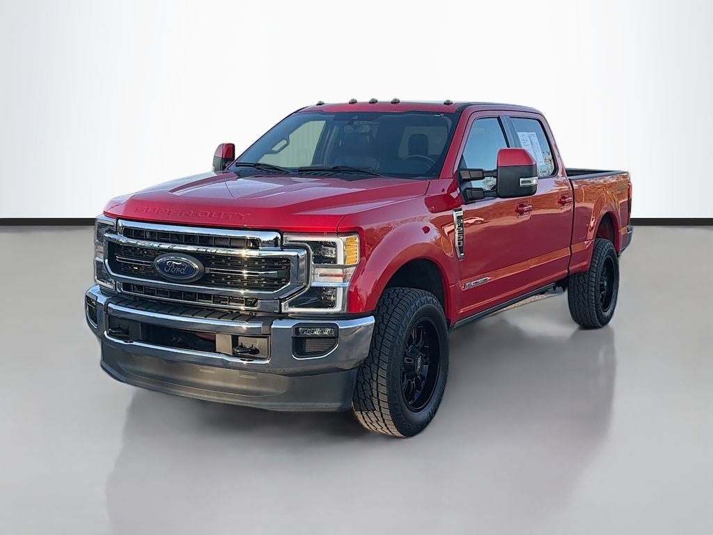 2021 Ford F-250 LARIAT in Race Red — front three-quarter view